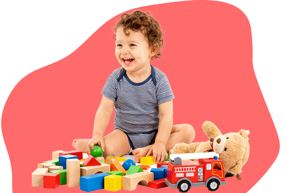 Toddler at child care playing with toys