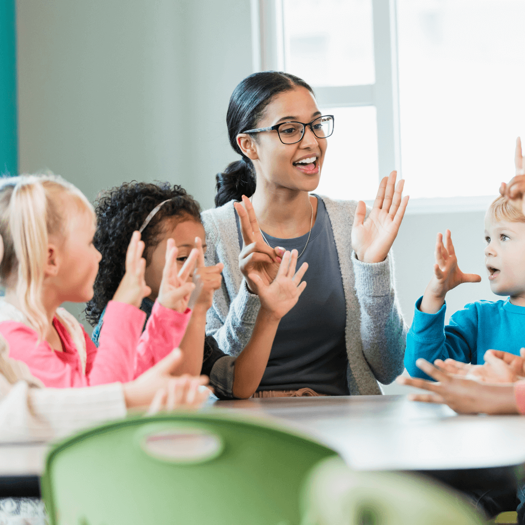 preschool kids and teacher playing